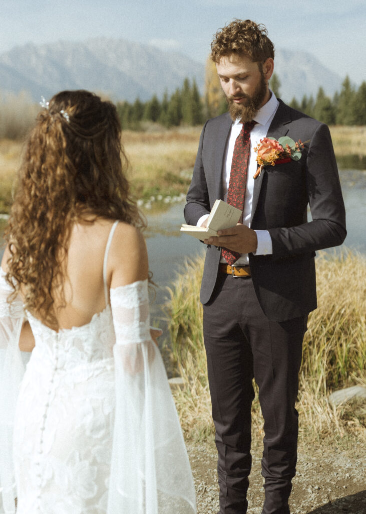 bride and groom reading their vows privately for their Grand Teton elopement 