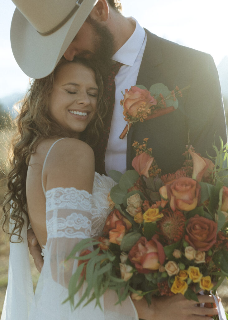 bride and groom taking sunset photos for their fall Grand Teton Elopement 