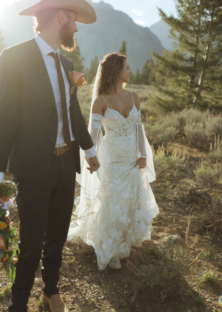 bride and groom taking sunset photos for their fall Grand Teton Elopement 