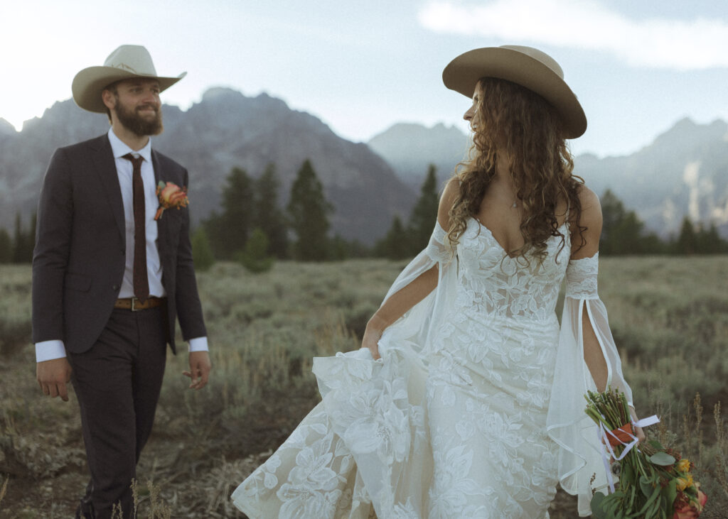 bride and groom taking sunset photos for their fall Grand Teton Elopement 