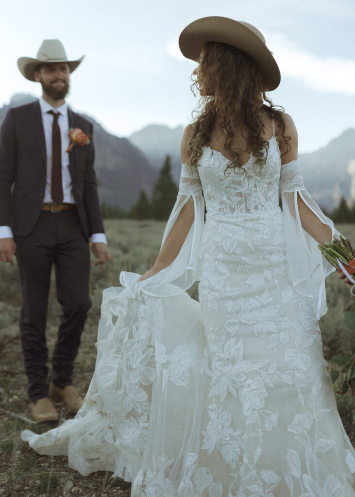 bride and groom taking sunset photos for their fall Grand Teton Elopement 