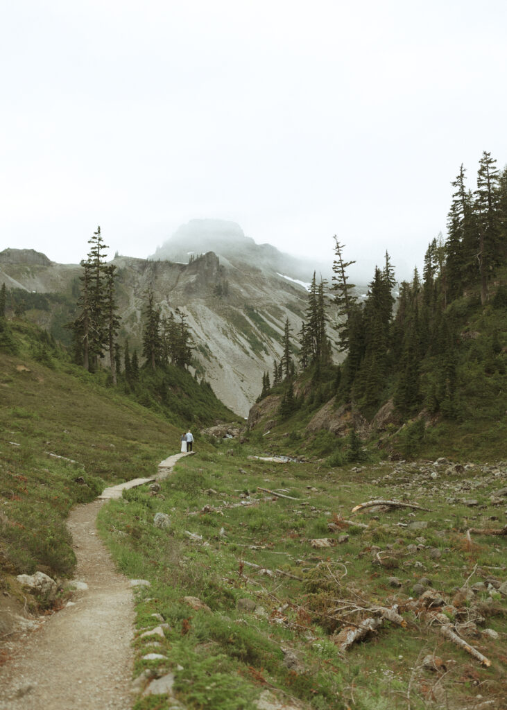 bride and groom walking on the trail for their Mount Baker Elopement 