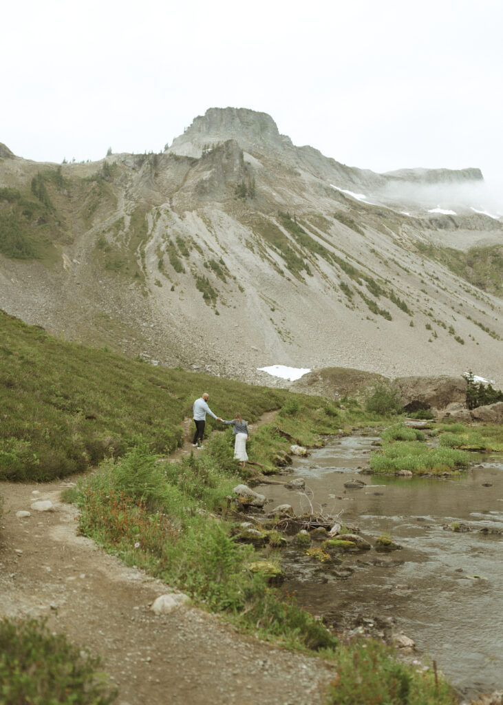 bride and groom walking on the trail for their Mount Baker Elopement 