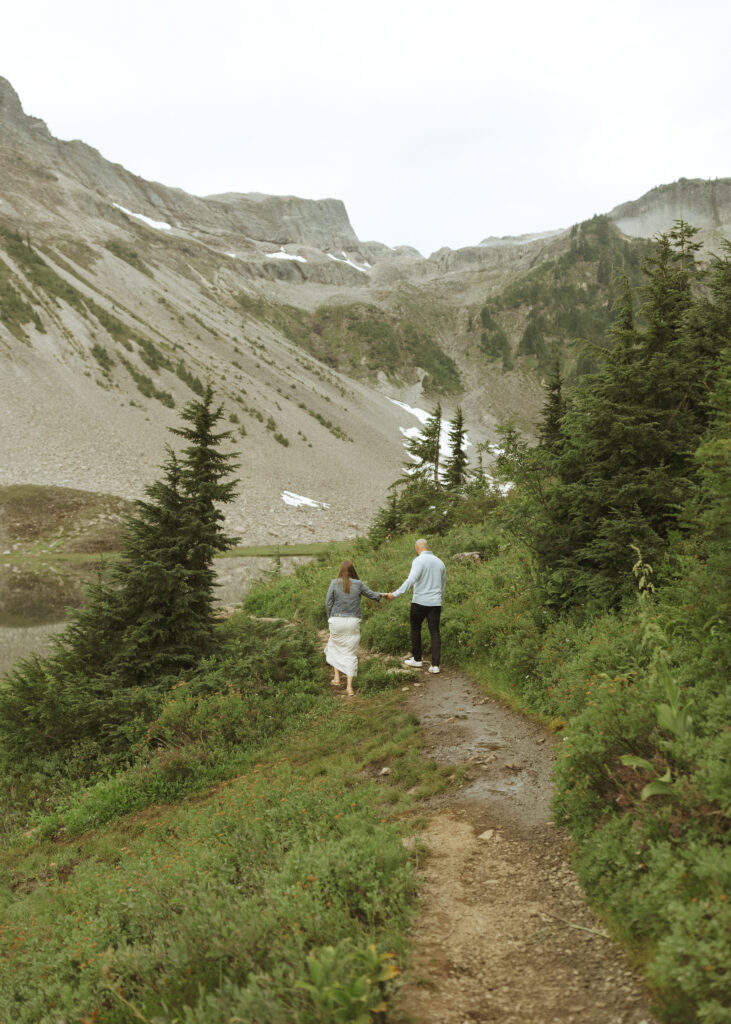 bride and groom walking on the trail for their Mount Baker Elopement 