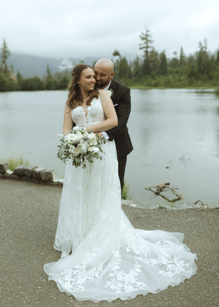 bride and groom take photos for their mount baker elopement 