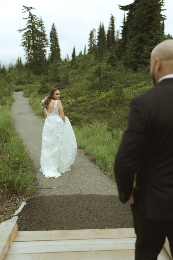 bride and groom walking on the trail for their Mount Baker Elopement 