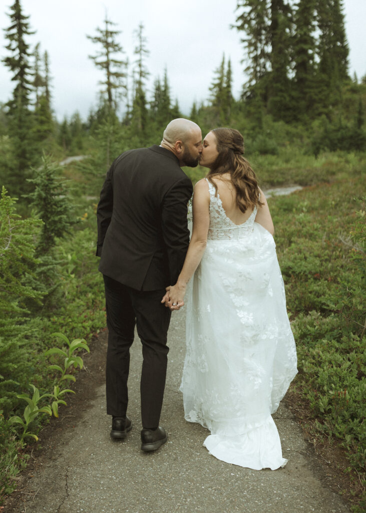 bride and groom walking on the trail for their Mount Baker Elopement 