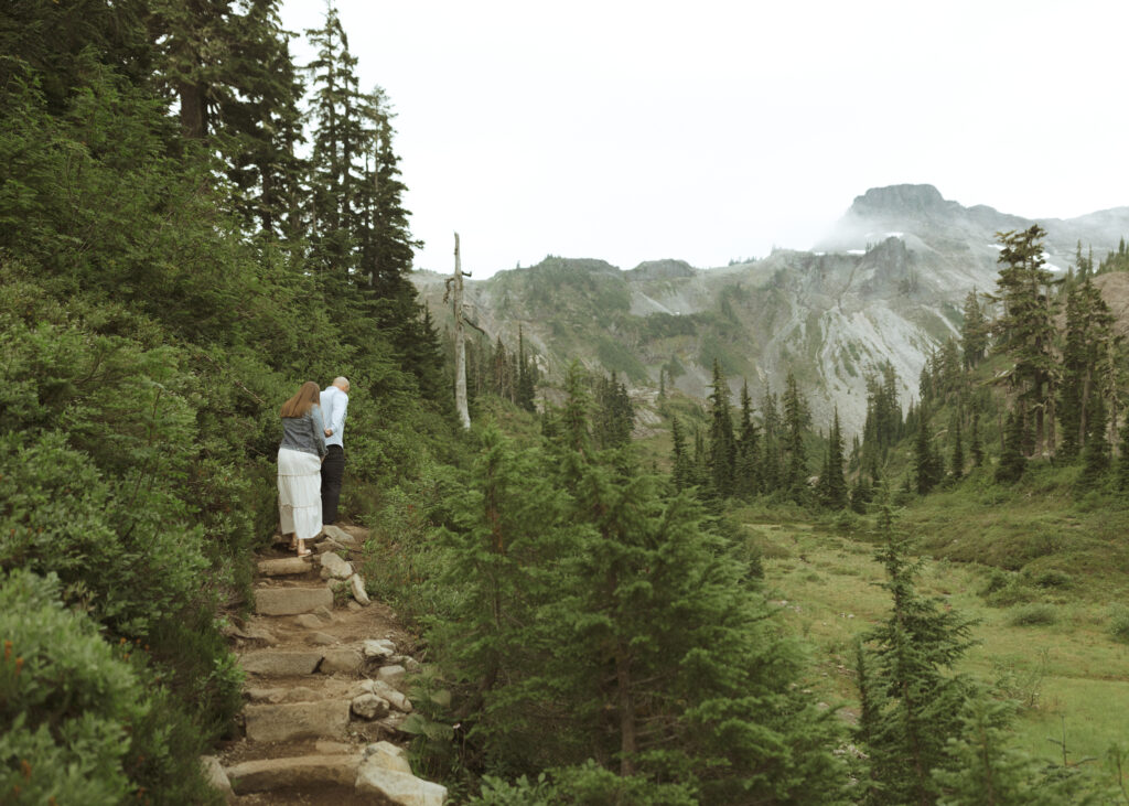 bride and groom walking on the trail for their Mount Baker Elopement 