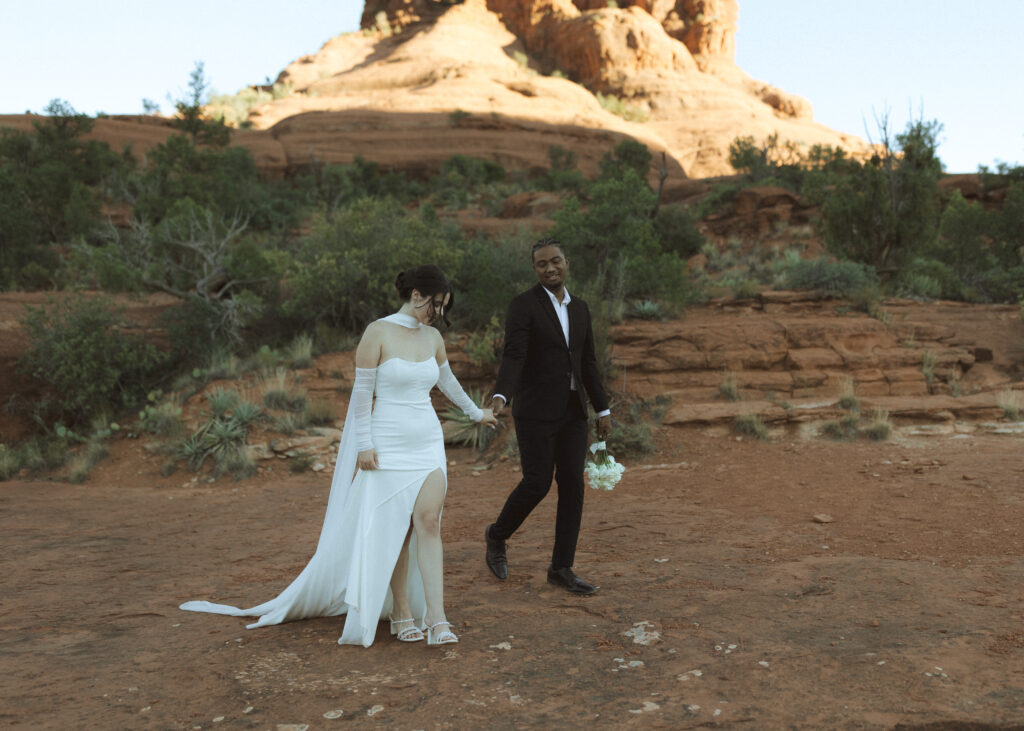 bride and groom taking photos for their bell rock sedona elopement 