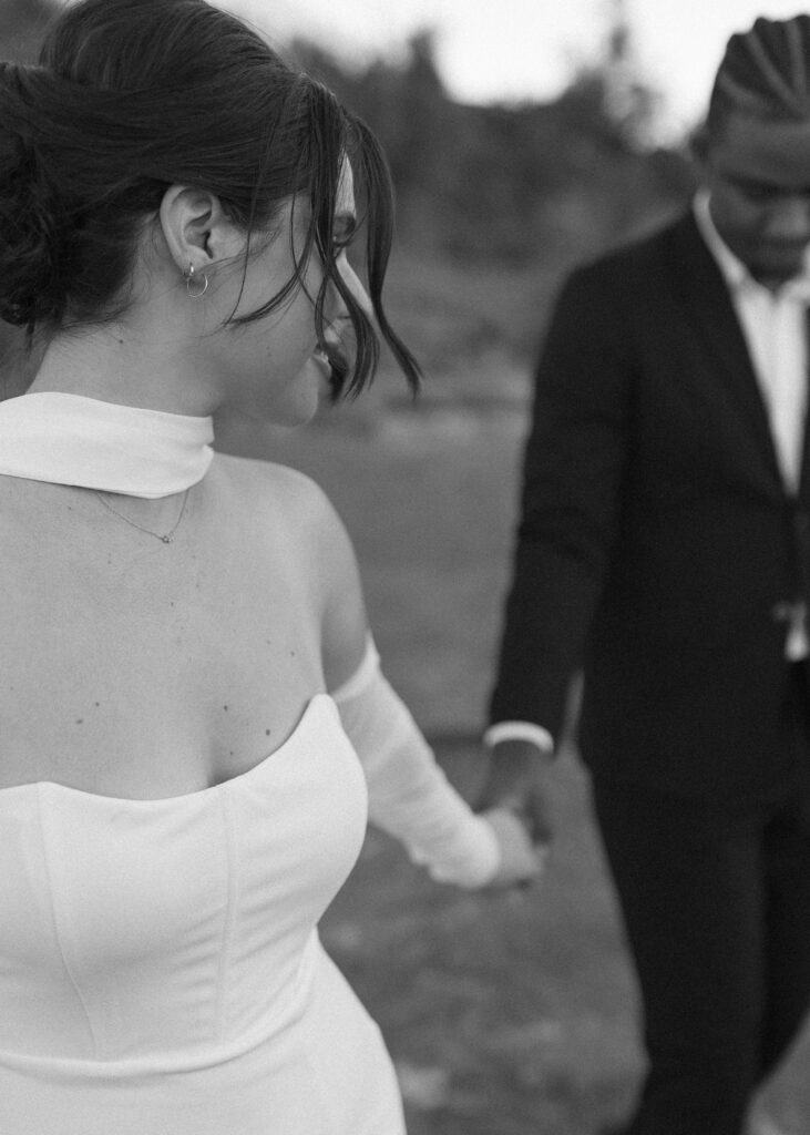 bride and groom taking photos for their bell rock sedona elopement 