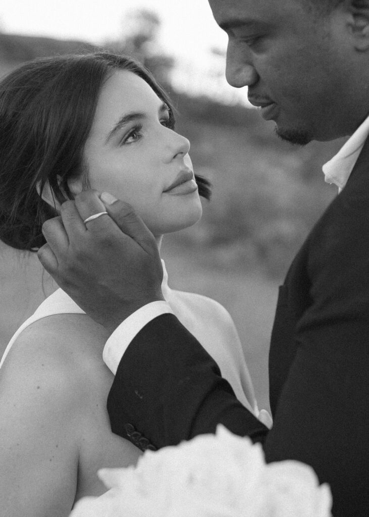 bride and groom taking photos for their bell rock sedona elopement 