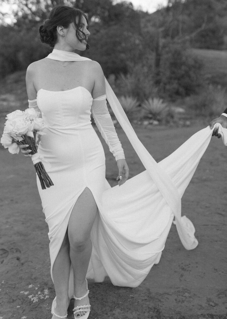 bride and groom taking photos for their bell rock sedona elopement 