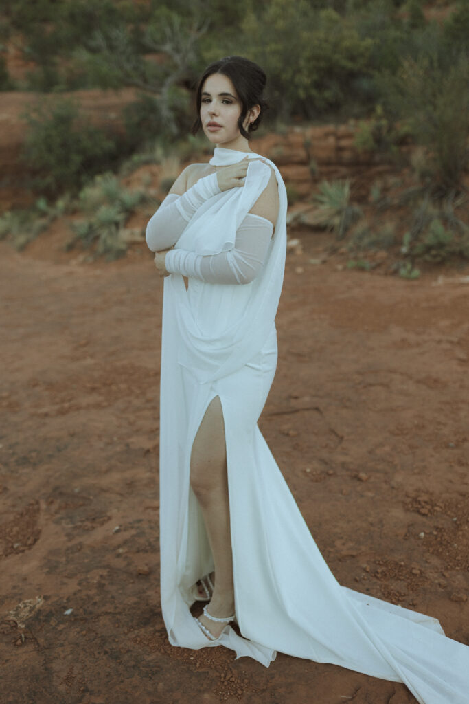 bride taking photos for their bell rock sedona elopement 