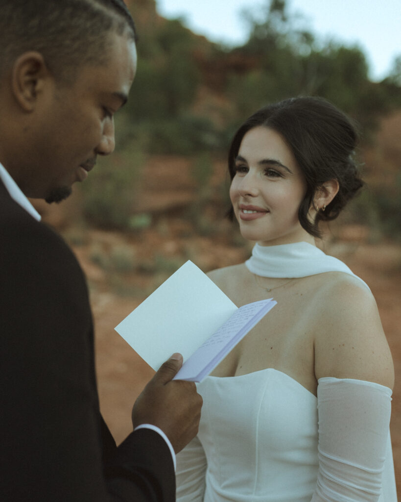 bride and groom exchanging vows for their bell rock sedona elopement 