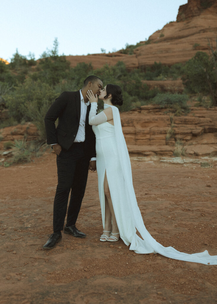 bride and groom taking photos for their bell rock sedona elopement 