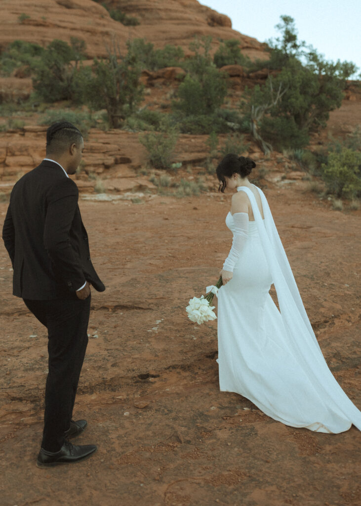 bride and groom taking photos for their bell rock sedona elopement 