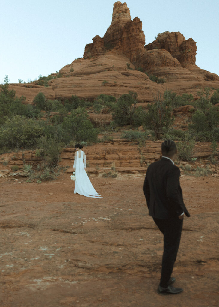 bride and groom taking photos for their bell rock sedona elopement 