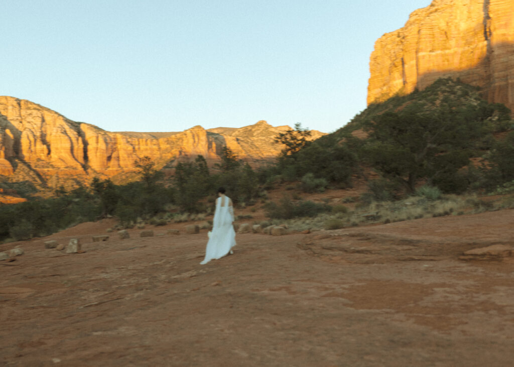 bride taking photos for her bell rock sedona elopement 