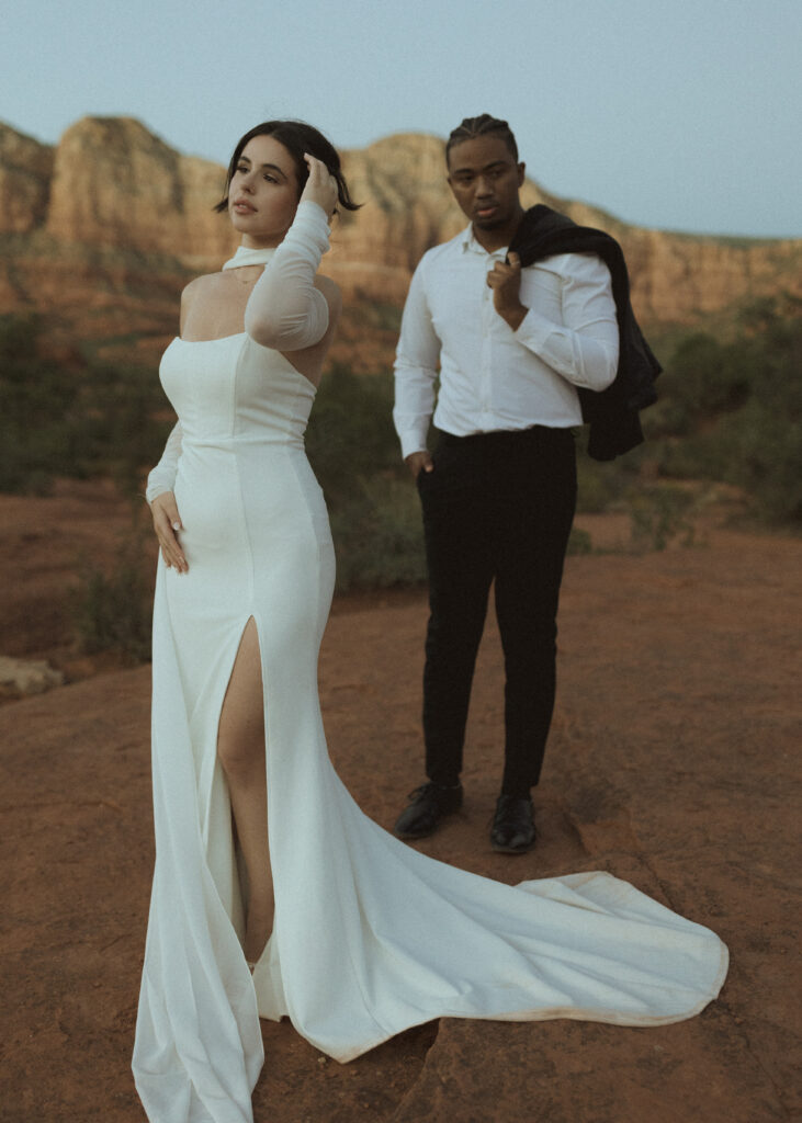 bride and groom taking photos for their bell rock sedona elopement 