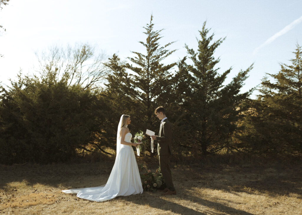 bride and groom reading vows at Roca Ridge Events 