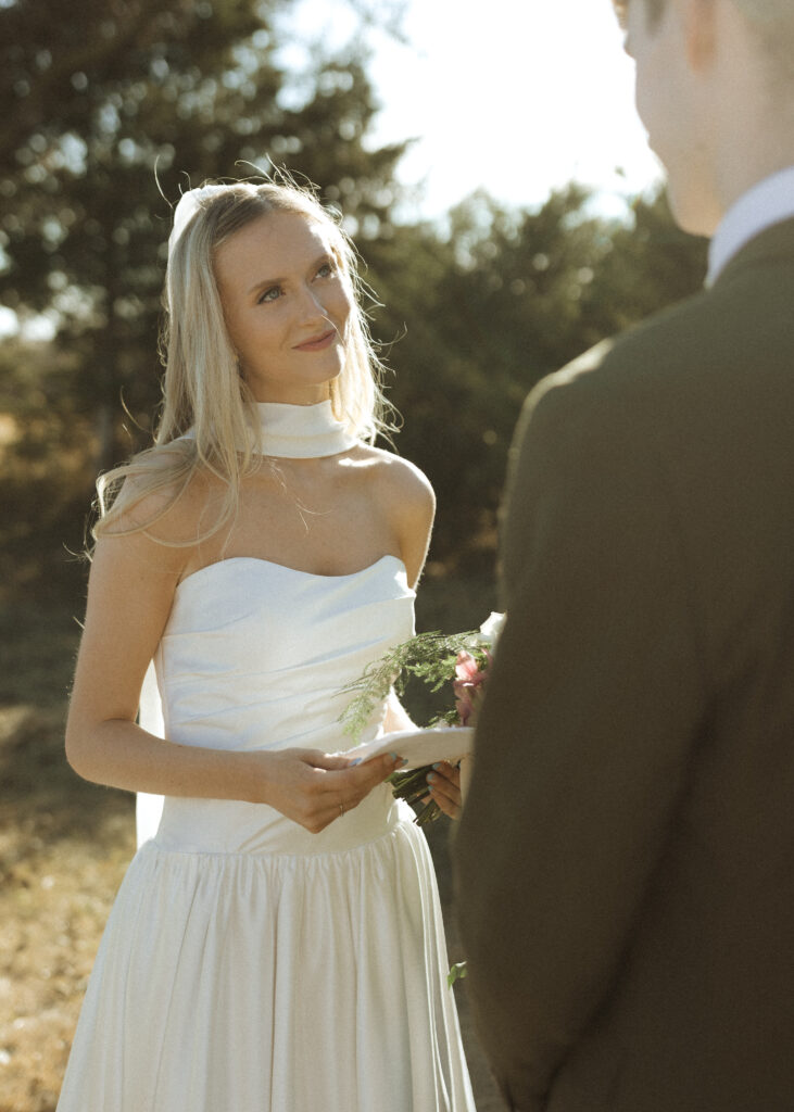 bride and groom reading vows at Roca Ridge Events 