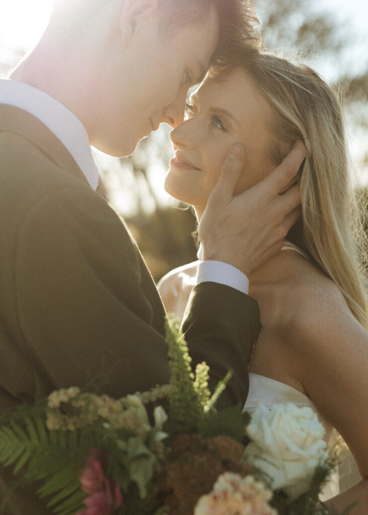 bride and groom taking photos for their Roca Ridge Events Wedding 