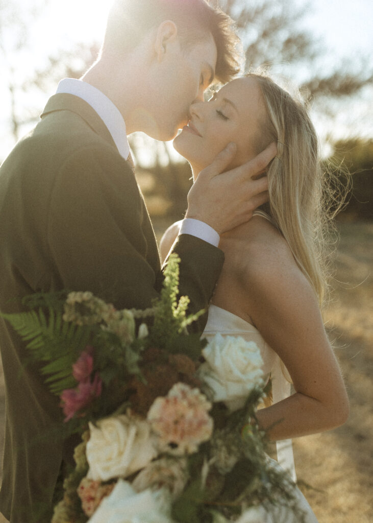 bride and groom taking photos for their Roca Ridge Events Wedding 