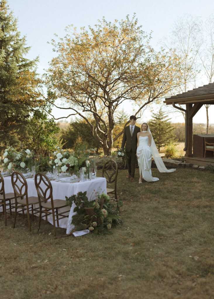 bride and groom taking photos for their Roca Ridge Events Wedding 