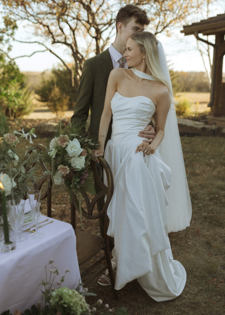 bride and groom taking photos for their Roca Ridge Events Wedding 