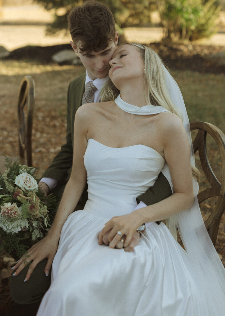 bride and groom taking photos for their Roca Ridge Events Wedding 