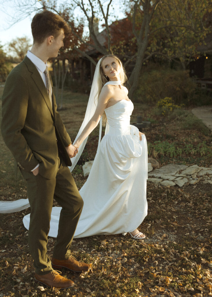 bride and groom taking photos for their Roca Ridge Events Wedding 