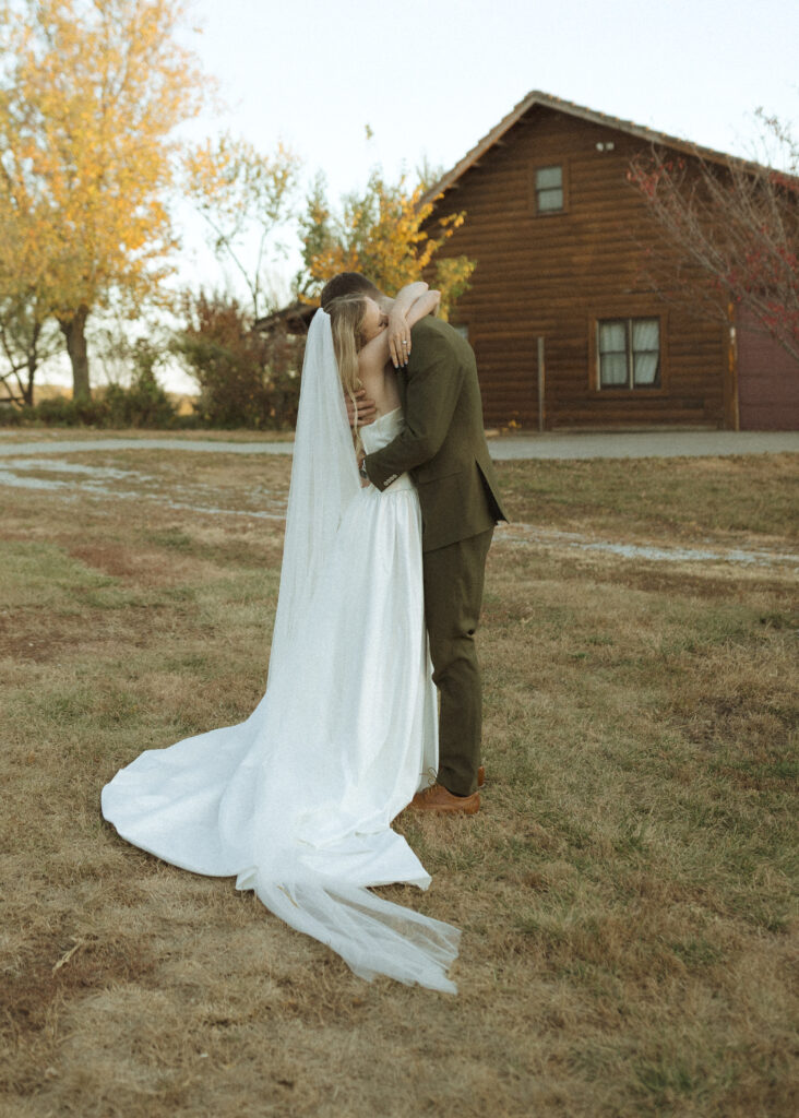 bride and groom taking photos for their Roca Ridge Events Wedding 