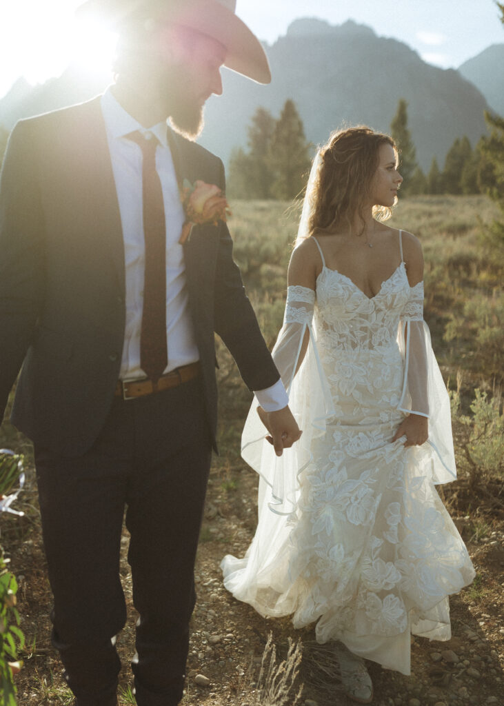 bride and groom taking wedding photos in grand teton national park 