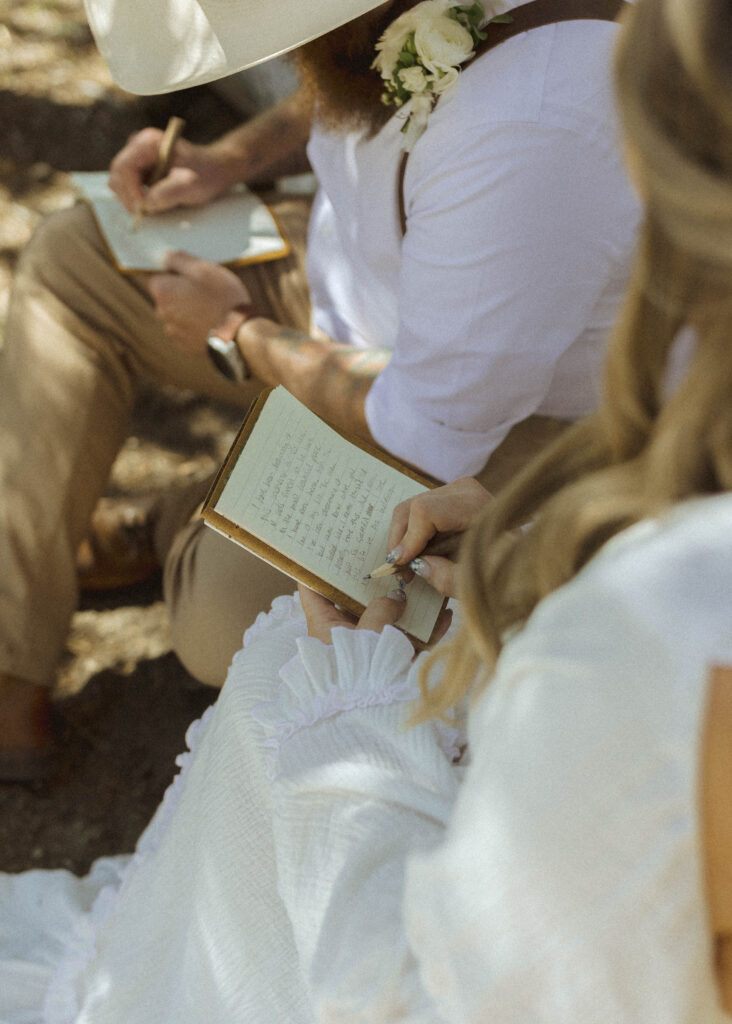 bride and groom writing vows in Grand Teton National Park 