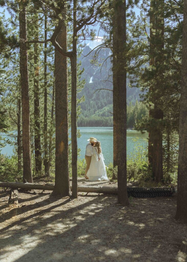 bride and groom taking wedding photos in grand teton national park 