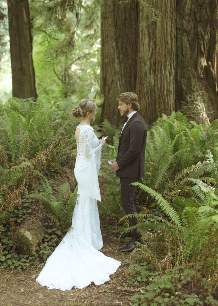 bride and groom reading their vows privately 