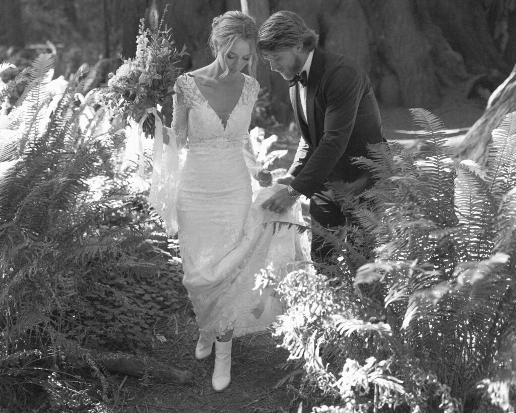 bride and groom taking photos for their redwoods wedding 