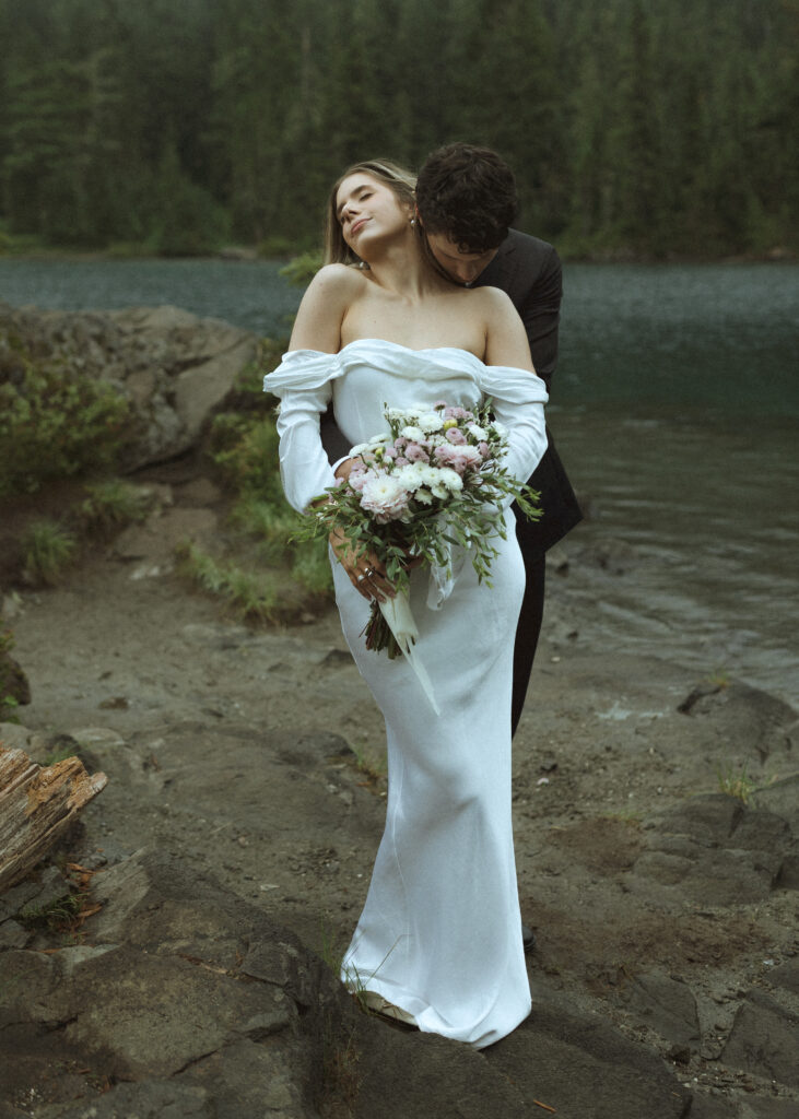 bride and groom taking their elopement photos 