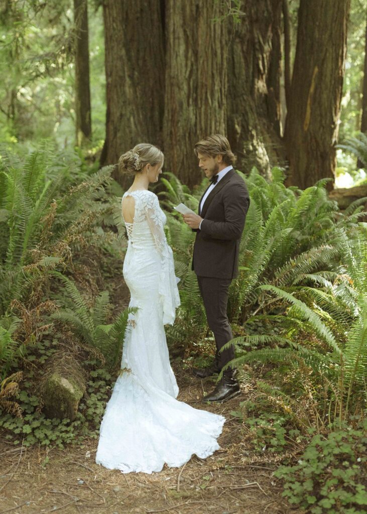 bride and groom reading their vows for their elopement 