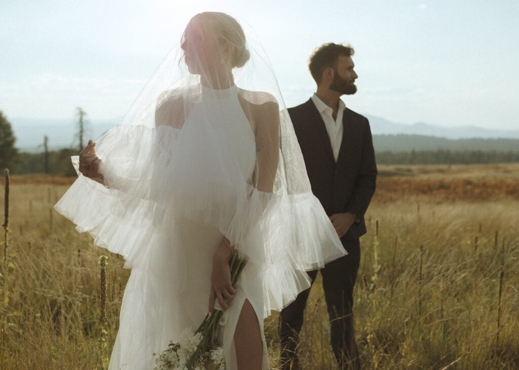 bride and groom taking their photos for their elopement 