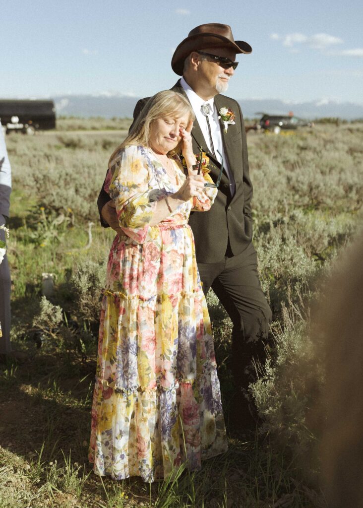 brides parents watching their daughters elopement ceremony 