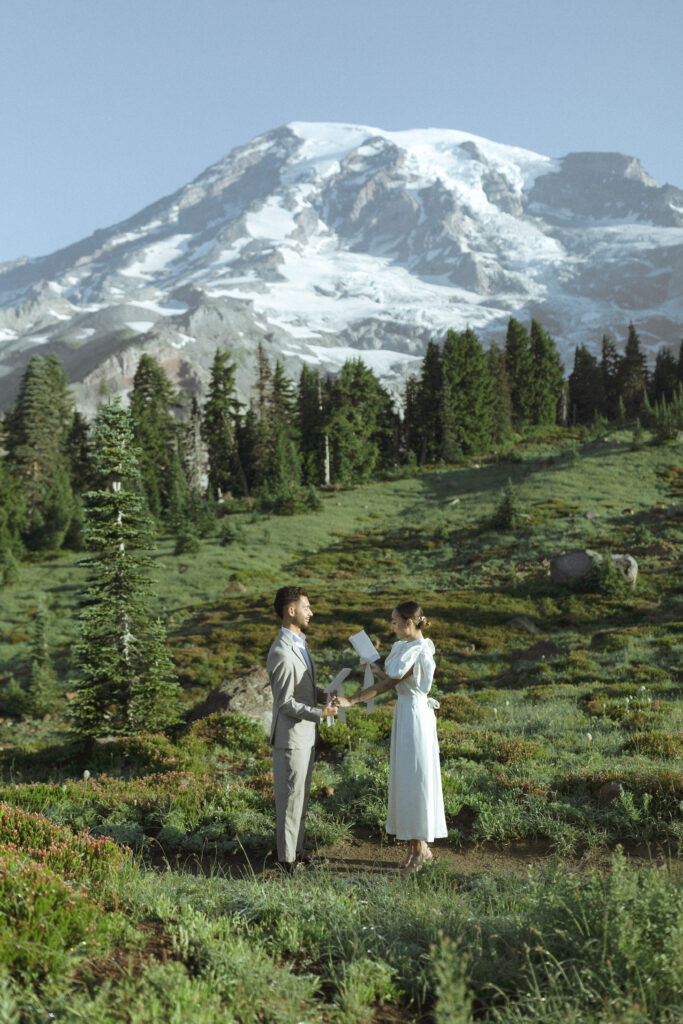 couple reading vows for their national park wedding 