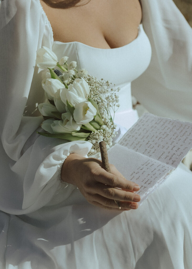 bride writing her vows for at her national park elopement