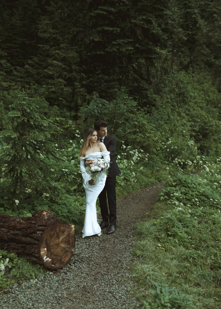 bride and groom taking photos for their national park elopement