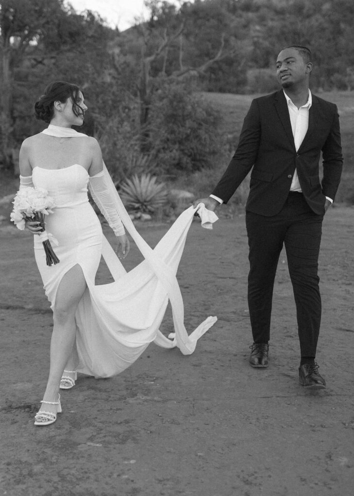 bride and groom taking photos for their elopement 