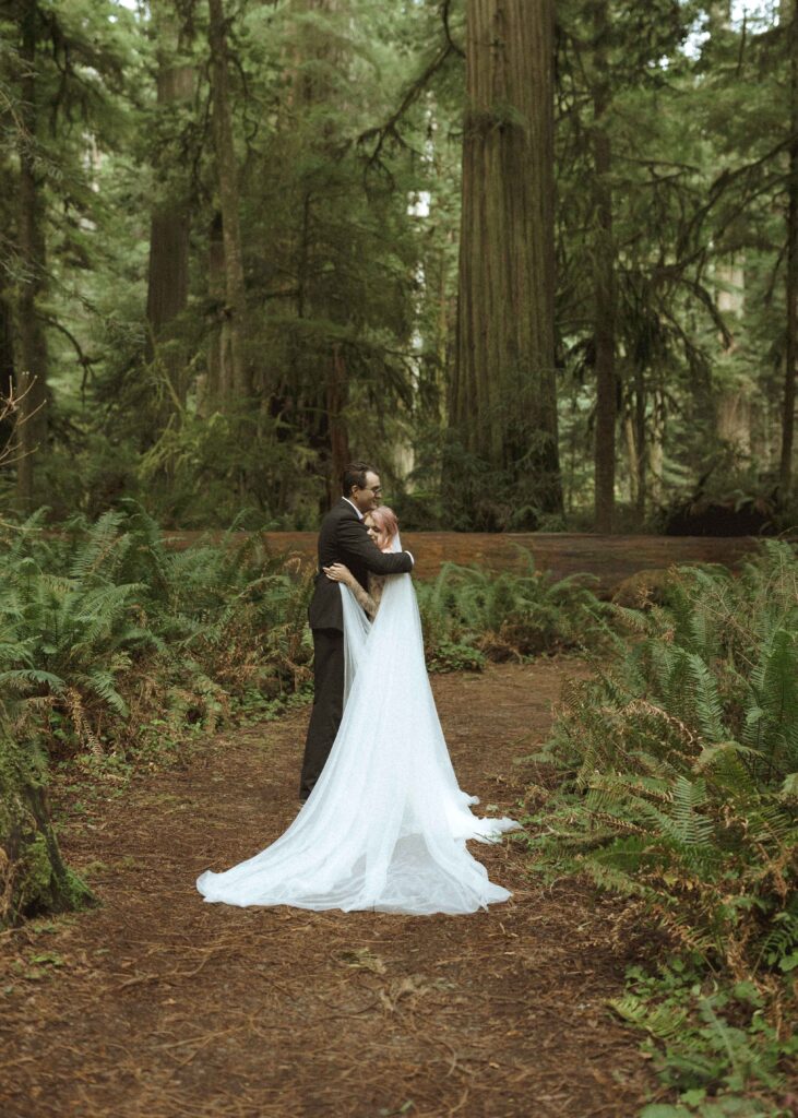 bride and groom taking photos for their elopement 