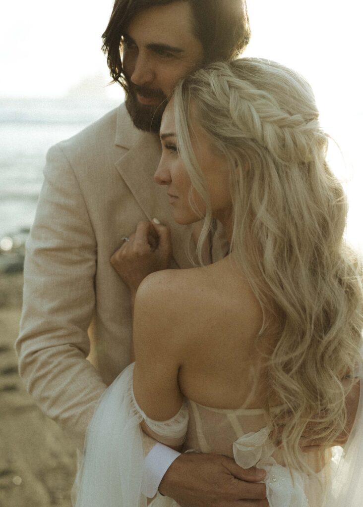 bride and groom taking photos for their elopement 