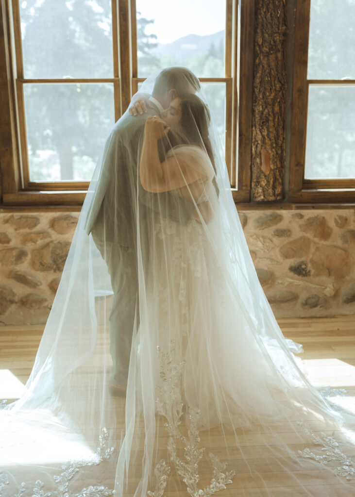 bride and groom taking photos for their garden of the gods elopement 