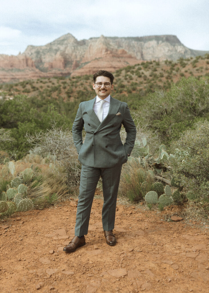 groom getting portrait in sedona