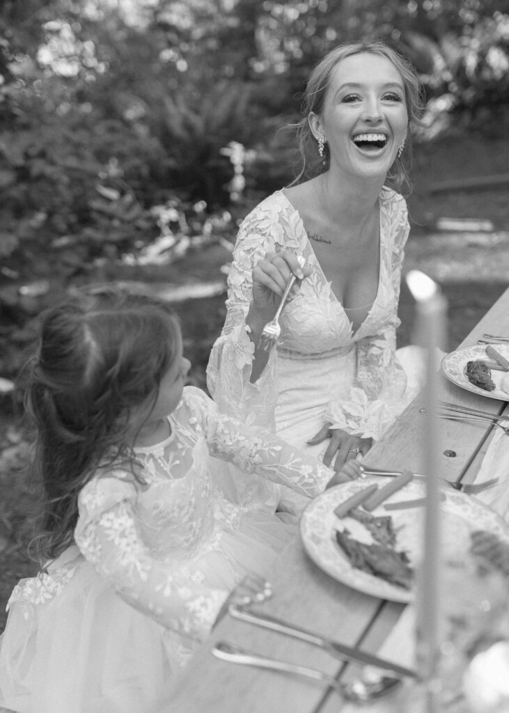 bride and daughter eating dinner in the redwoods